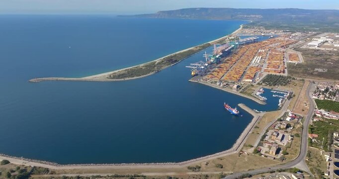 Aerial view of the industrial port of Gioia Tauro, located in the province of Reggio Calabria. It is the largest port in Italy by container throughput and the sixth largest in the Mediterranean Sea.