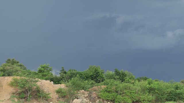 Strong winds and cloudy skies precede rain and storms in the summer.