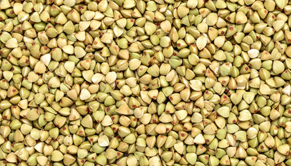 Fototapeta premium Raw green buckwheat groats texture background top view