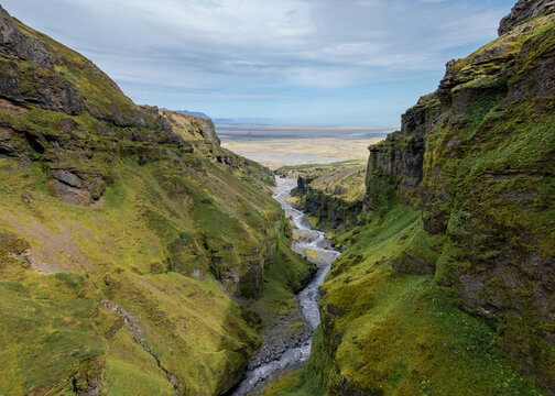 view of the Mulakvisi River fowing through and out of the Mulagljufur Canyon in southern Iceland