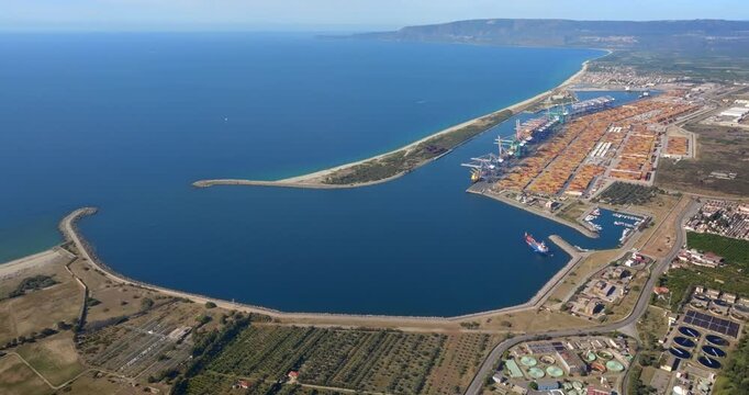Aerial view of the industrial port of Gioia Tauro, located in the province of Reggio Calabria. It is the largest port in Italy by container throughput and the sixth largest in the Mediterranean Sea.