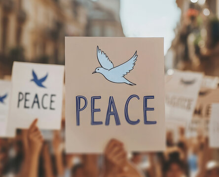 person holding a sign with a dove symbol and the text PEACE