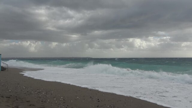 A strong, stormy wind breaks huge waves of the Mediterranean Sea on the beaches of the coast of Antalya, Turkey.