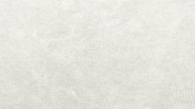 soft white cotton fabric texture closeup revealing delicate knit weave and subtle fibrous details in serene neutral palette for minimalist design backgrounds