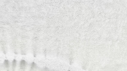 Obraz premium pristine white textured fabric with subtle gray drips cascading downward evoking serene minimalist winter frost melt in soft ethereal light