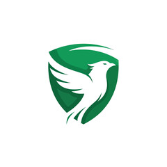 Obraz premium White Phoenix Bird Rising from Green Shield Emblem