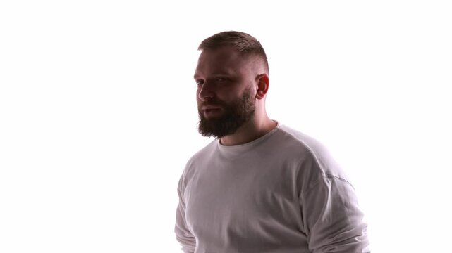 Bearded man standing still during 360 degree rotation on white background. Concept of product presentation, digital human showcase, virtual assistant interface, and human avatar reference.