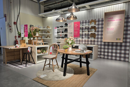 Penang, Malaysia &ndash; November 7, 2025: Cookware, frying pans, and food storage containers displayed on shelves inside an IKEA store.