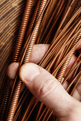 The master's hand holds strings of a musical instrument different sizes, background music. Close up detail of the string of an acoustic guitar, piano.