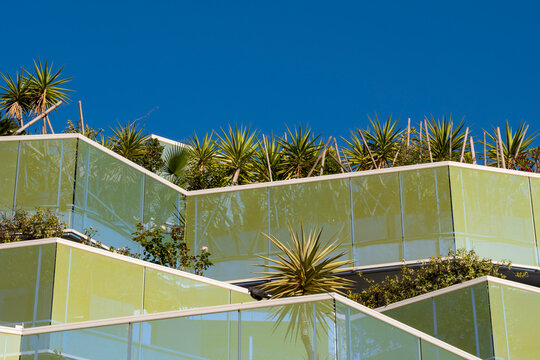 Architecture modern building terrace garden plants facade design under sky for sustainable living concept showing contemporary balconies and greenery
