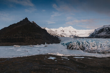 Scenic view of Svinafellsjokull outlet glacier. Rugged ice landscape falling from Vatnajokull National Park in Southeast Iceland.