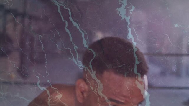 Male boxer scanning ring then throwing jabs with blue wraps, lightning overlay fueling training