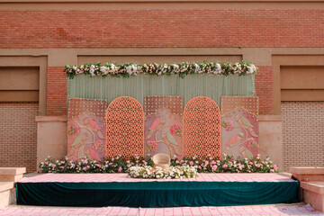 Elegant Wedding Stage Decoration with Floral Accents and Intricate Designs for Memorable Celebrations, Festivities and Special Events, with Beautiful Backdrop