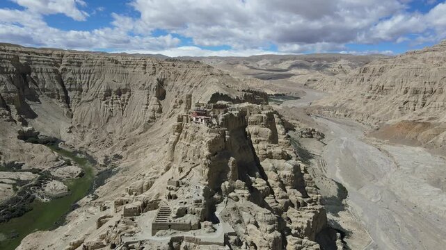Drone Orbiting Ancient Guge Kingdom Cliffside Ruins in Earth Forest, Ngari, Tibet
