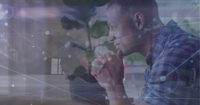 Animation of connected dots over multiracial man doing pushup and thoughtful man at home