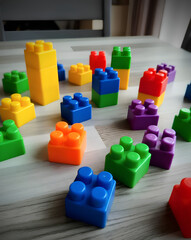 Colorful toy block cubes on table © Studio Brodip