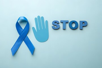 Fototapeta premium Blue awareness ribbon symbol for men's health issues alongside a hand gesture and the word stop against a light blue background promoting prevention and caution