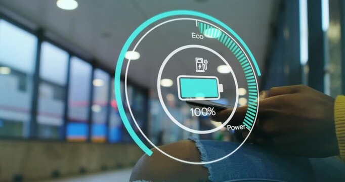 Woman holding smartphone after AR app launch and monitoring battery cycling for energy management