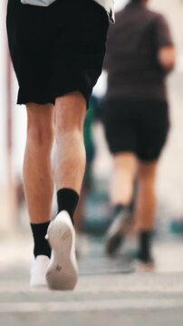 Runners competing in marathon, achieving fitness goals