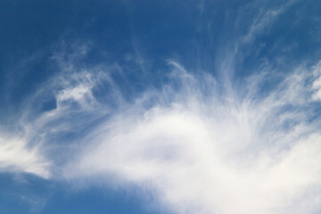 Fototapeta premium Exceptional white cloud shapes against a deep blue sky