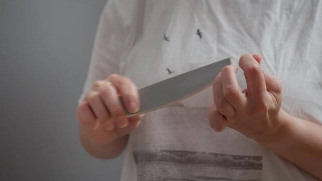 Woman hands using emery board to file natural nails at home. Personal hygiene, beauty routine or grooming process. Scratching sound of nail file on fingernails included in the video.