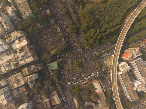 Dhaka, Bangladesh - 31 December 2025: Aerial view of a dense gathering of people converging near Hatirjheel, a vibrant hub where urban life meets nature's tranquility.