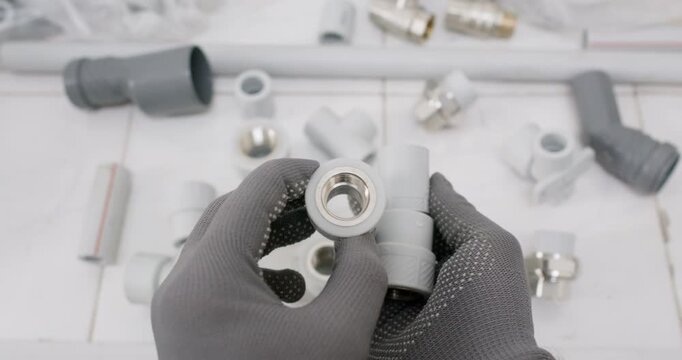 Technician shows tee fitting with metal insert and clean female thread. Plumber inspects bore verifying thread pitch while checking O ring seat confirming alignment