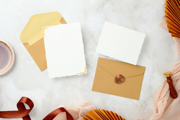 Wedding invitation suite mockup with two blank cards, envelopes, and wax seal details.