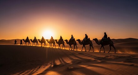 Caravan of camels traversing the desert at sunset.