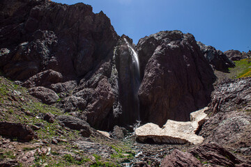 Waterfalls at the Sat Glacier Lakes. Lake landscapes in bloom in spring. Hakkari Cilo Sat Lakes. A lake view in the mountains. Hakkari Cilo Sat Glacier Lakes, mountains covered with flowers.Long expos