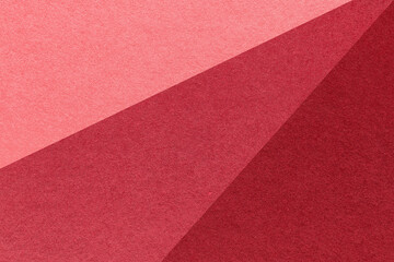 Fototapeta premium Abstract geometric pink red wine paper texture background with diagonal split. Rays pattern decorative backdrop