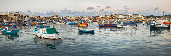 Luzzu, traditional fishing boat anchored in the bay, Marsaxlokk, Republic of Malta, Europe © Tolo