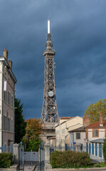 Obraz premium Lyon, France - 10 23 2025: View of Fourvière Metal Tower a the top of Fourvière hill with cloudy and sunny sky