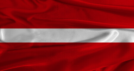 Flag of Latvia with fabric textured background. Close up of National flag of Latvia with realistic...