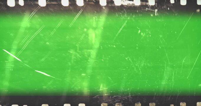 film strip transition, with chroma key green screen background, effect of old film rolling with details, scratches and grain, vintage strip intro