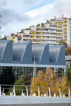 Modern residential architecture in Boulogne Billancourt Paris France on a rooftop urban setting with an apartment view and autumn trees below