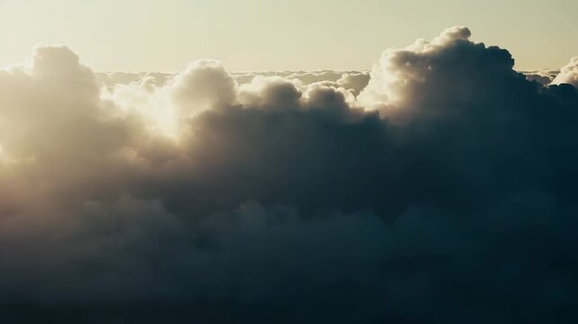 Clouds creating a soft, expansive abstract background, their forms gently merging with the calm, pastel toned sky, evoking a sense of tranquility and a dreamy, atmospheric aesthetic