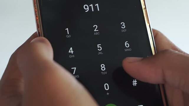 Emergency and urgency, dialing 911 on smartphone screen.