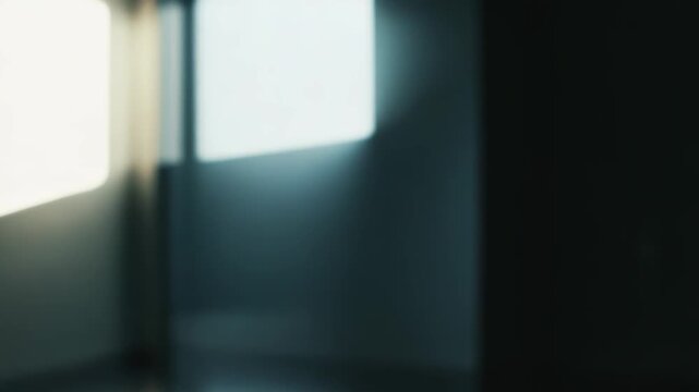 Abstract scene featuring bright, linear shafts of light and reflections creating dynamic geometric patterns on a dark, polished surface, suggesting modern architecture and minimalist design