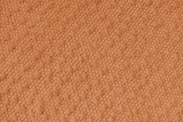 Fototapeta premium Orange jacquard upholstery fabric with raised fluffy pom pom pattern, weave creating rich textured cloth surface. Decorative textile background for furniture, interior design, upholstery backdrop