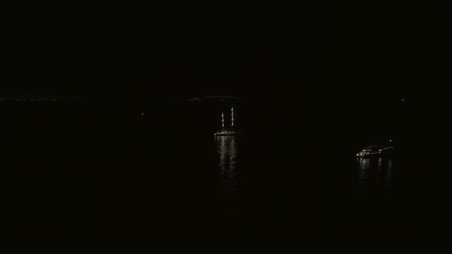 Boats In Tranquil Bay In Procida, Italy At Night - Drone Shot