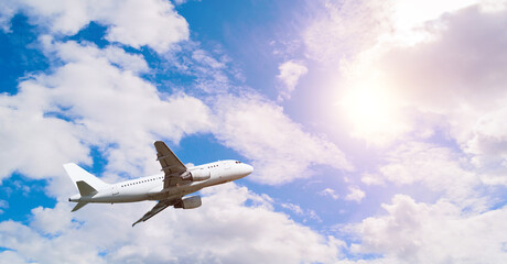 Vast panoramic view with airplane flying in the blue sky, summer air travel background