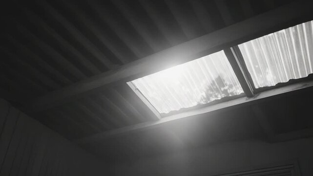 Indoor scene showing bright sunlight streaming through a corrugated plastic skylight, highlighting the textured ceiling and creating a sense of natural illumination and openness in the room