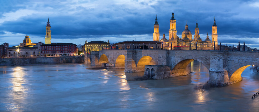 Zaragoza - The cityscape from cathedral Basilica del Pilar tower with the Puente de Piedra bridge,