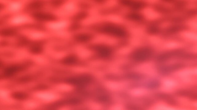 Abstract blurred red background with soft, glowing bokeh effect and subtle dark patterns.