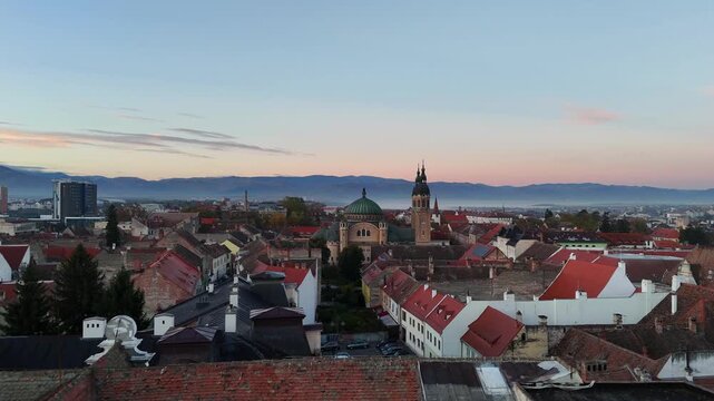 30 october 2024, Sibiu, Romania. Sunrise, backward drone flight reaveal, Holy Trinity Cathedral, Ortodoxă "Sf&acirc;nta Treime" at sunrise. Beautiful  touristic must-see destination. mountains, travel desti