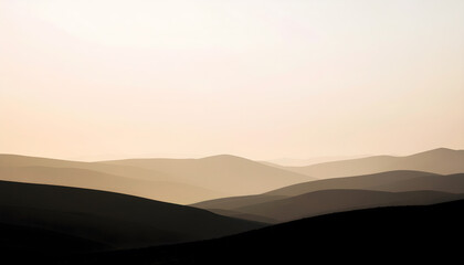 Morning fog drifting across distant mountain landscape