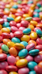 Colorful candy-coated chocolate pieces in various shades of red, pink, blue, yellow, and green scattered on a surface, creating a vibrant and appealing display