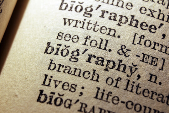 Word biography printed on dictionary page, macro close up