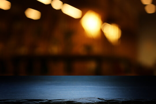 table and lights background during night time. Product display or mock up